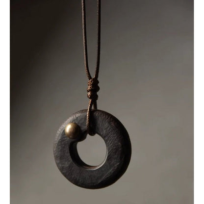 Black sandal wooden circle pendant