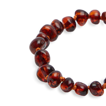 "Levenselixer" baby armband in cognac amber