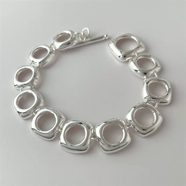 Bold look, sturdy sterling silver bracelet with square frame links and OT clasp