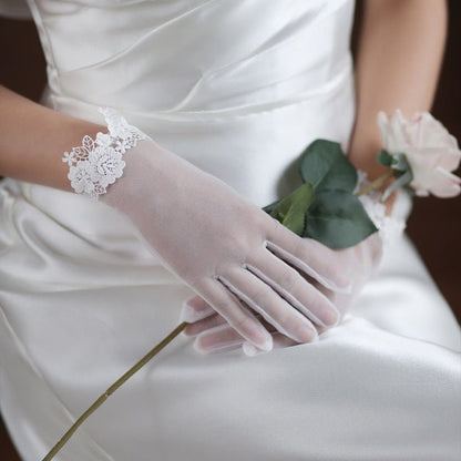 Bridal gloves with pearl and lace edges