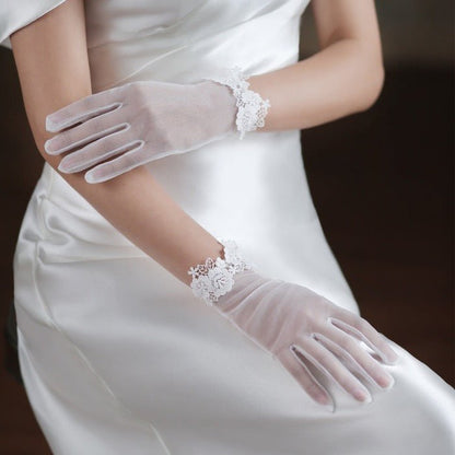 Bridal gloves with pearl and lace edges