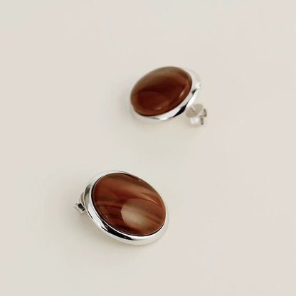 Oval stud earrings with tiger eye stone and MOP in a striking look