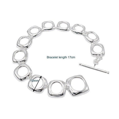 Bold look, sturdy sterling silver bracelet with square frame links and OT clasp