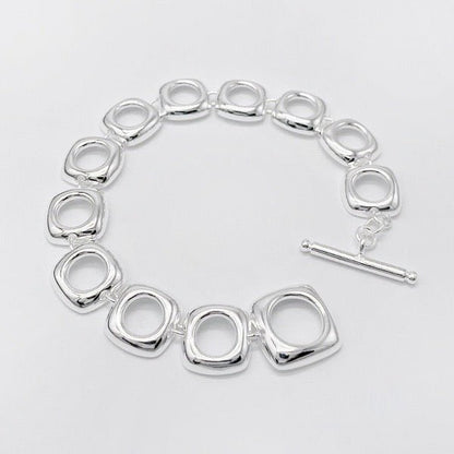 Bold look, sturdy sterling silver bracelet with square frame links and OT clasp