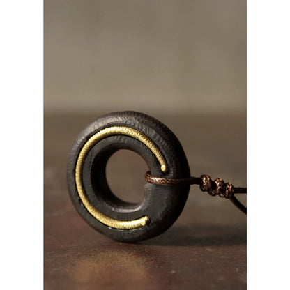 Black sandal wooden circle pendant