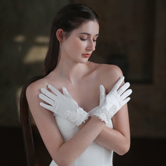 Satin white bridal gloves with lace flowers