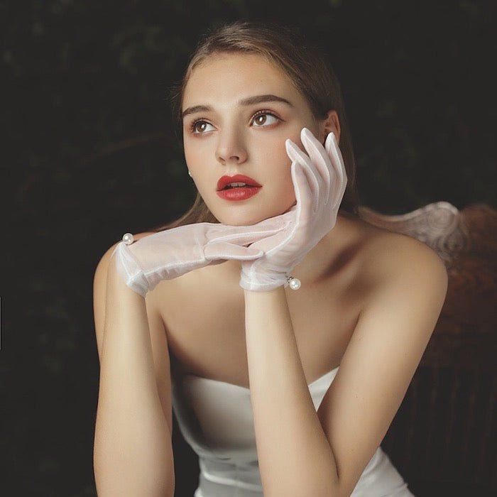 Bridal gloves with pearl and lace edges