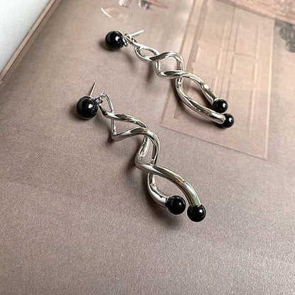 Silver spiral line earrings with black stone