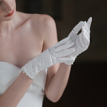 Satin white bridal gloves with lace flowers