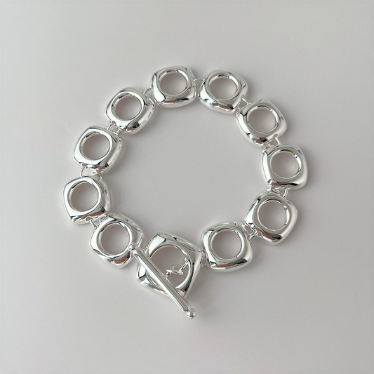 Bold look, sturdy sterling silver bracelet with square frame links and OT clasp