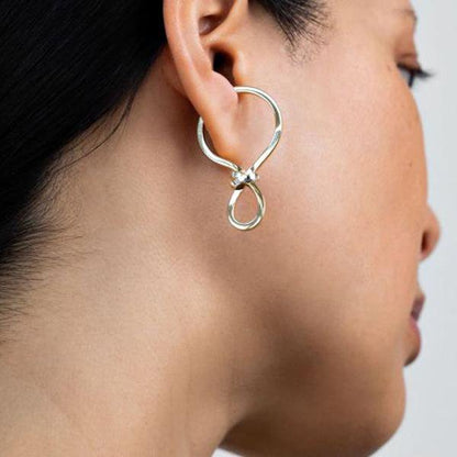 Minimalist one piece button ear cuff