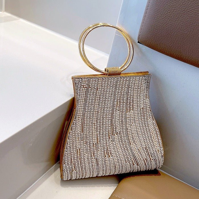 Glanzende feestclutch met parelkralen-zilver en goud